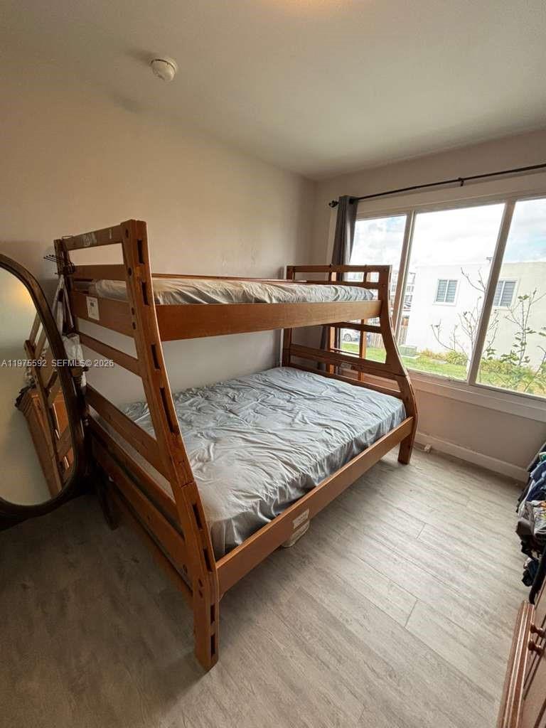 13900 Southwest 259th Street Homestead, FL 33032 - Photo 14 of 23 a living room with a rug bed and a table