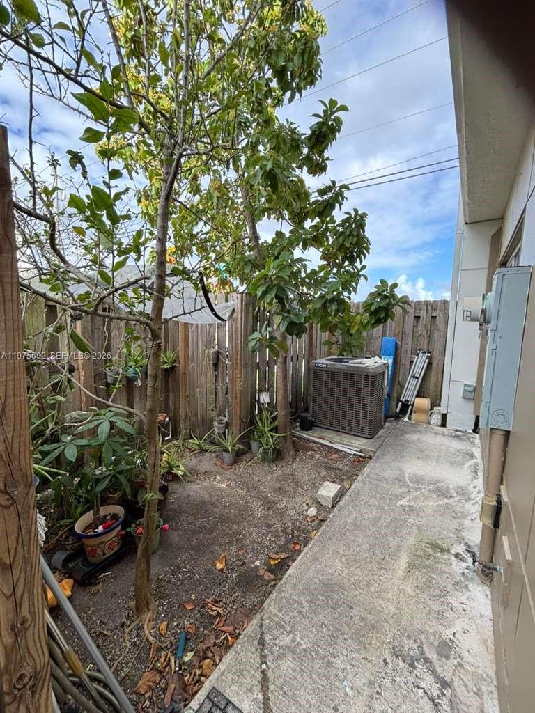 13900 Southwest 259th Street Homestead, FL 33032 - Photo 18 of 23 a backyard of a house with lots of green space