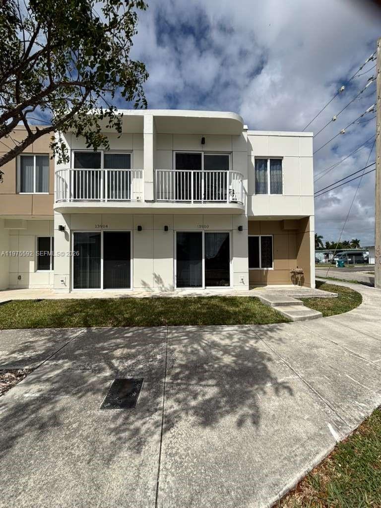 13900 Southwest 259th Street Homestead, FL 33032 - Photo 21 of 23 front view of a building