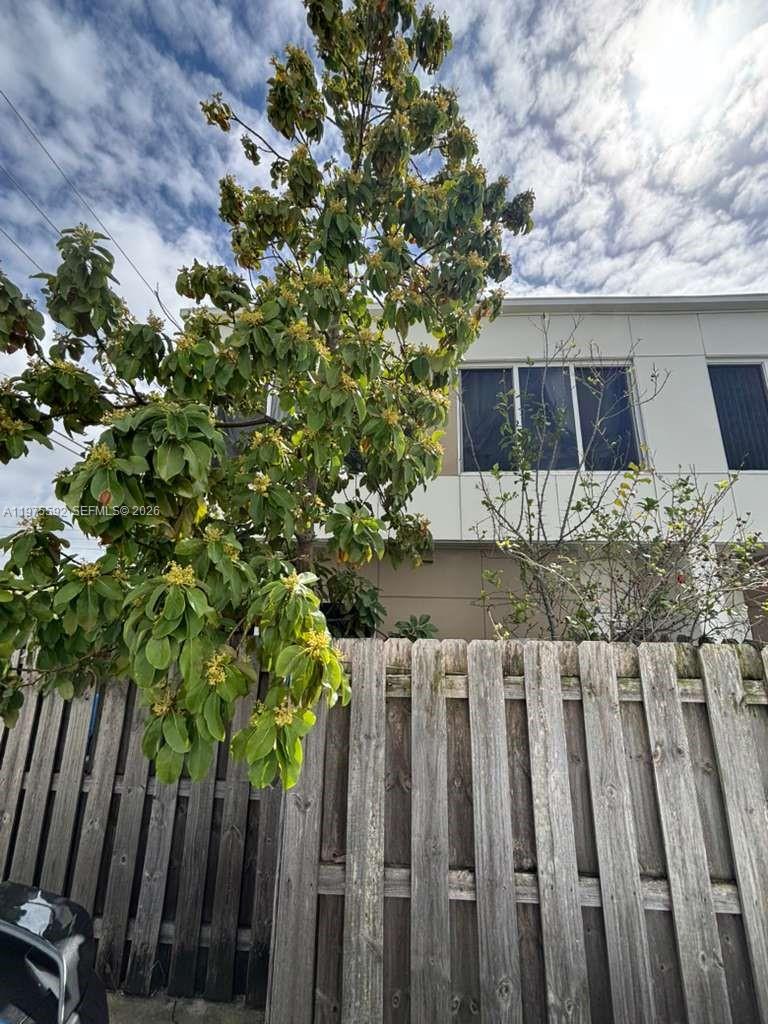 13900 Southwest 259th Street Homestead, FL 33032 - Photo 22 of 23 a view of a house with wooden fence