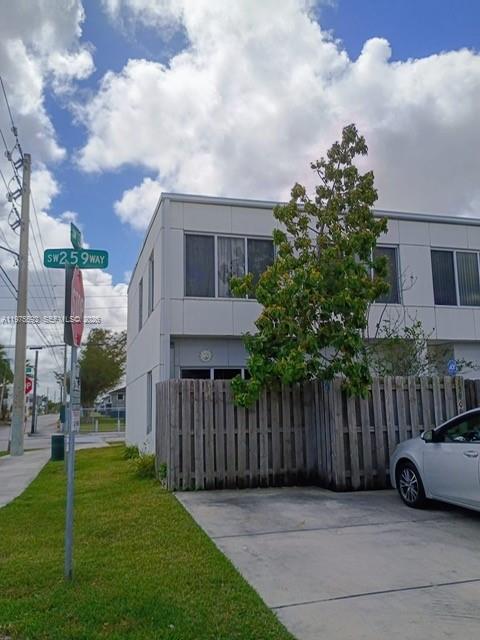 13900 Southwest 259th Street Homestead, FL 33032 - Photo 3 of 23 a view of a car in front of a house