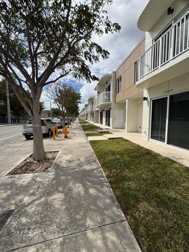 13900 Southwest 259th Street Homestead, FL 33032 - Photo 4 of 23 a view of a white house with a yard