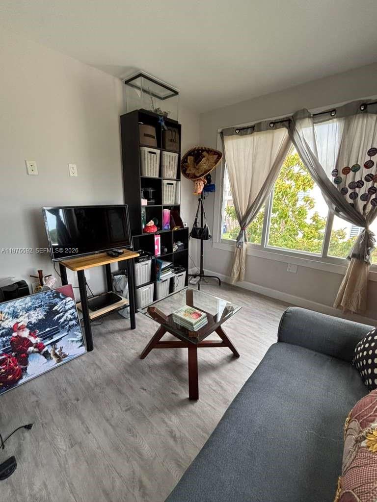 13900 Southwest 259th Street Homestead, FL 33032 - Photo 10 of 23 a living room with furniture and a window