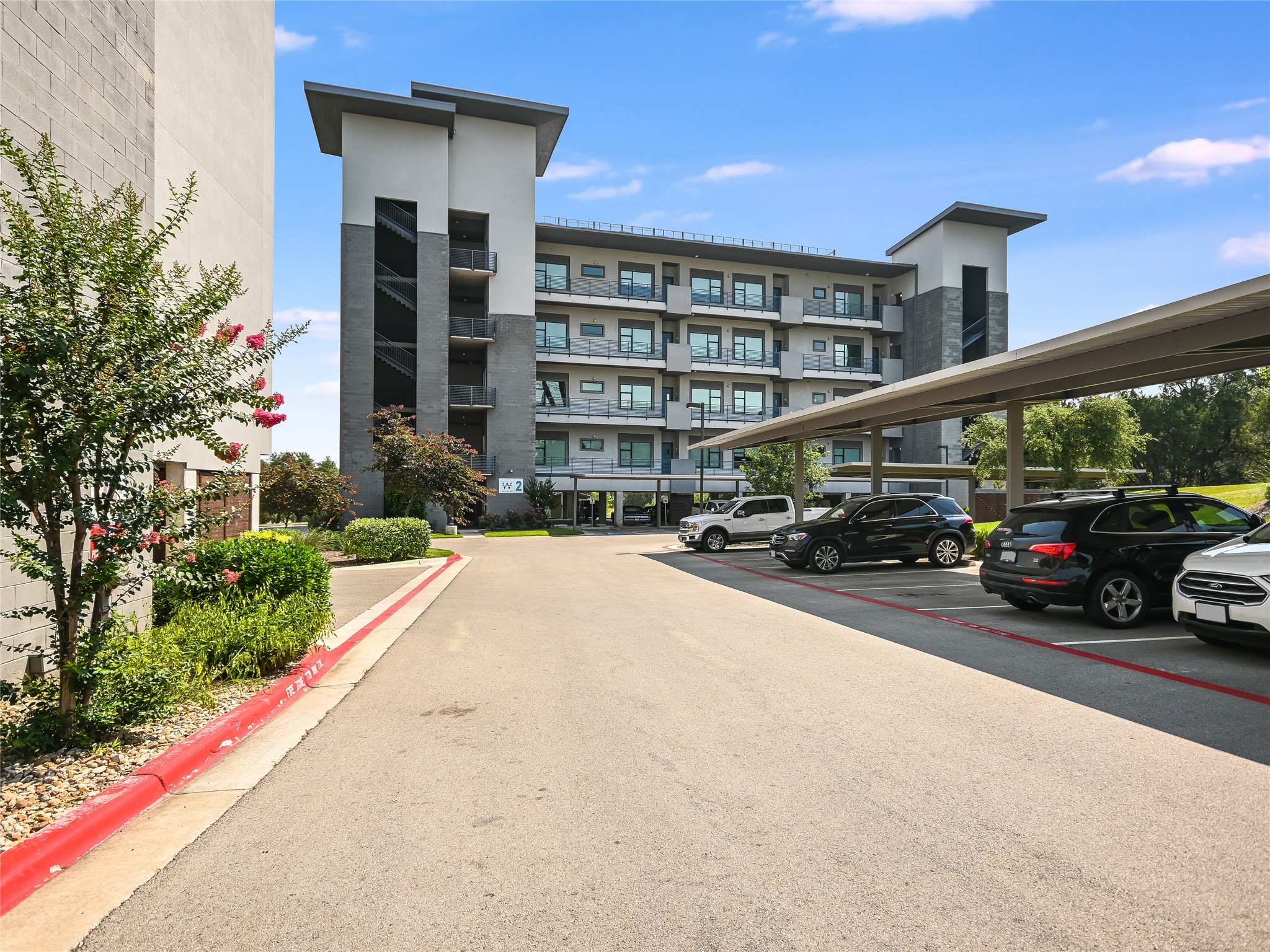 5921 Hiline Road, Unit 2403 Austin, TX 78734 - Photo 24 of 35 One reserved parking space in the under building garage, while guests can also enjoy covered parking.