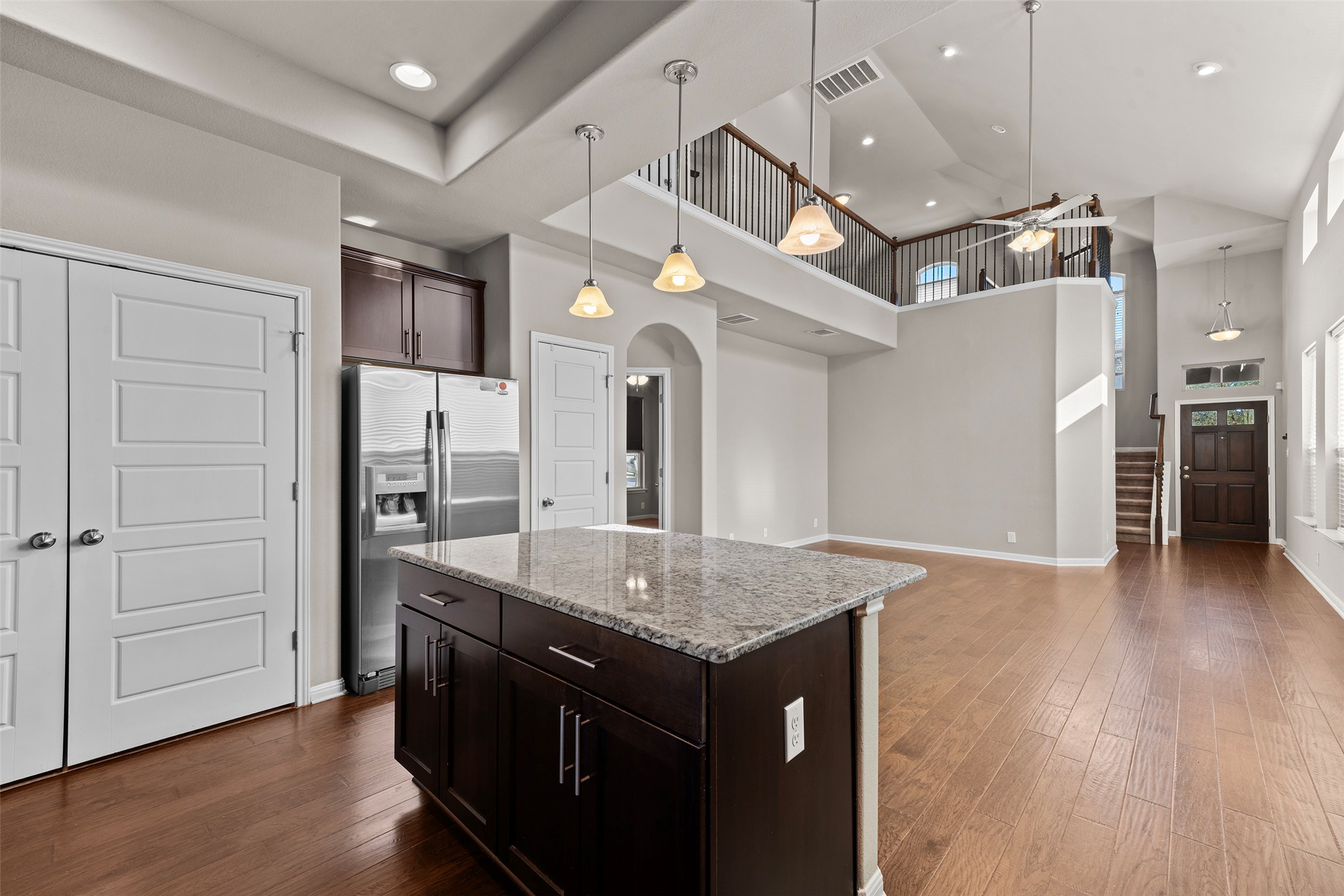 7233 Menchaca Road, Unit 2 Austin, TX 78745 - Photo 11 of 34 an open kitchen with a table and chairs