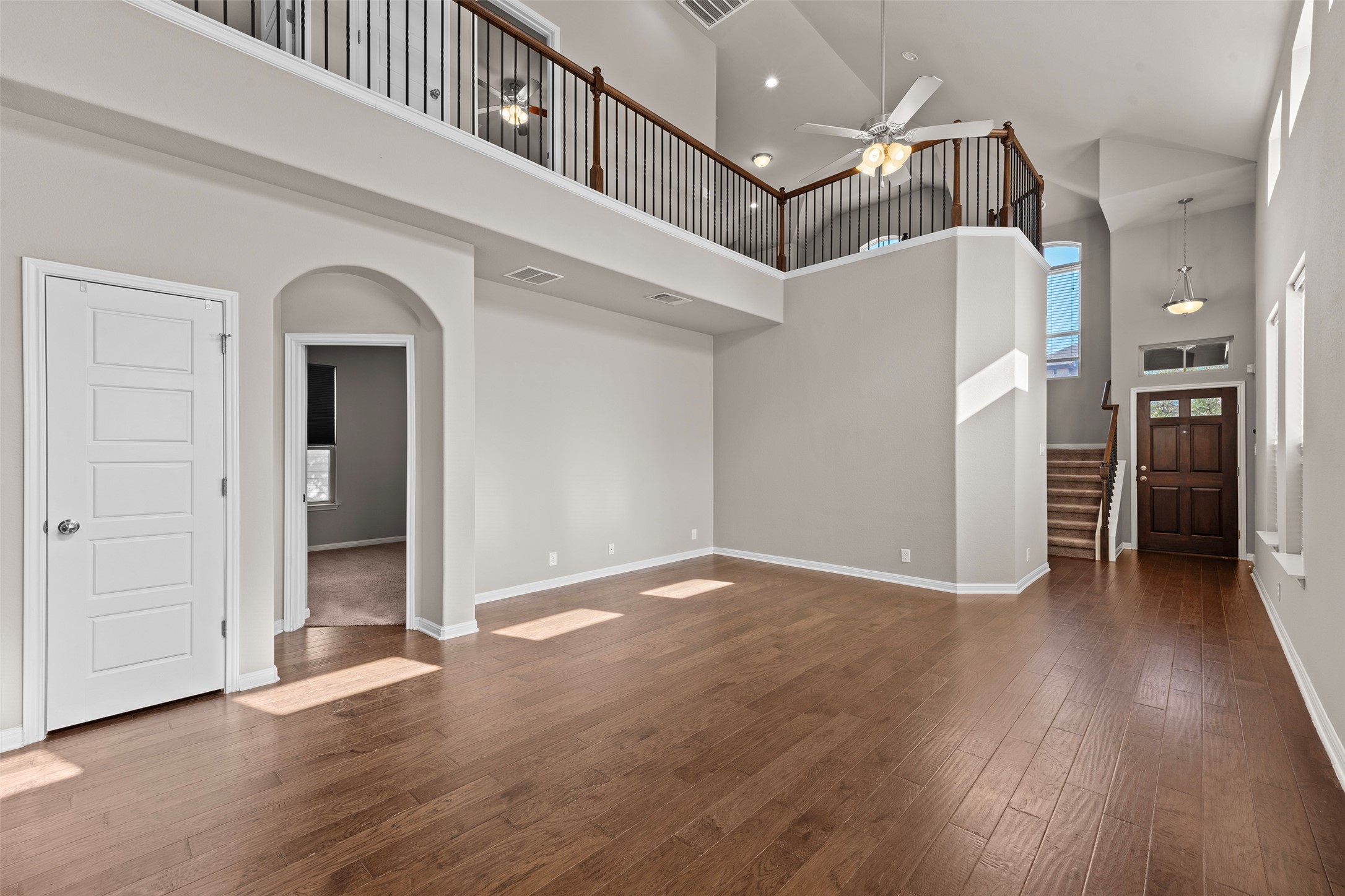 7233 Menchaca Road, Unit 2 Austin, TX 78745 - Photo 12 of 34 a view of a hallway with wooden floor and entryway