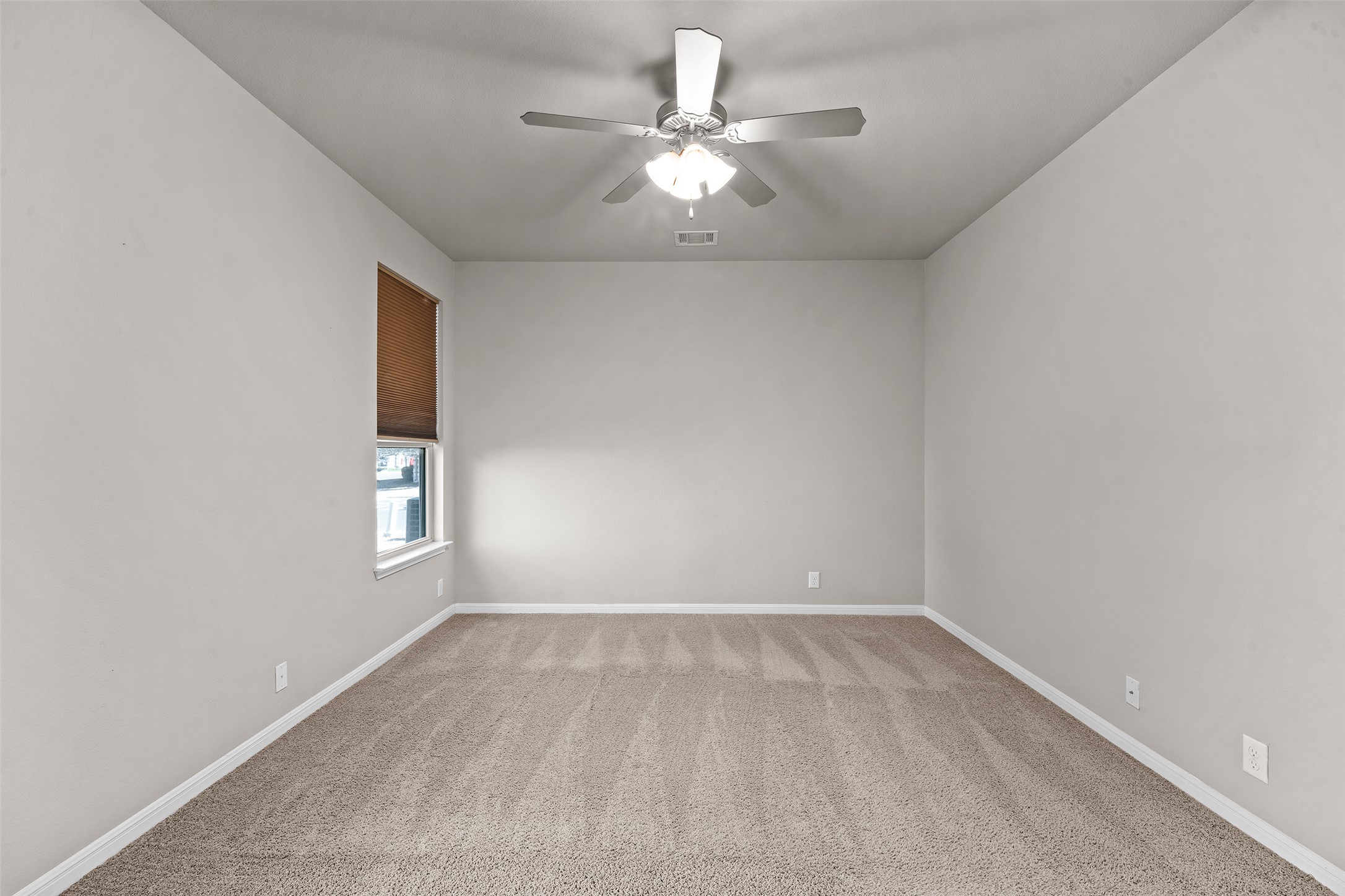 7233 Menchaca Road, Unit 2 Austin, TX 78745 - Photo 18 of 34 wooden floor in an empty room with a window