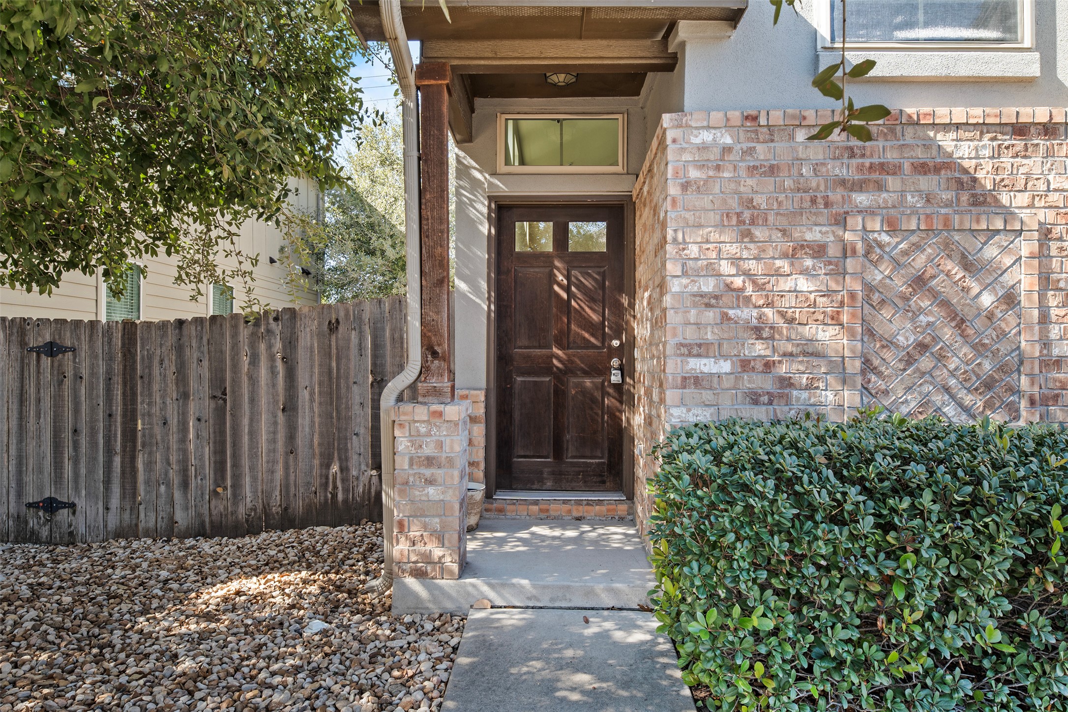 7233 Menchaca Road, Unit 2 Austin, TX 78745 - Photo 2 of 34 a front view of a house with a door