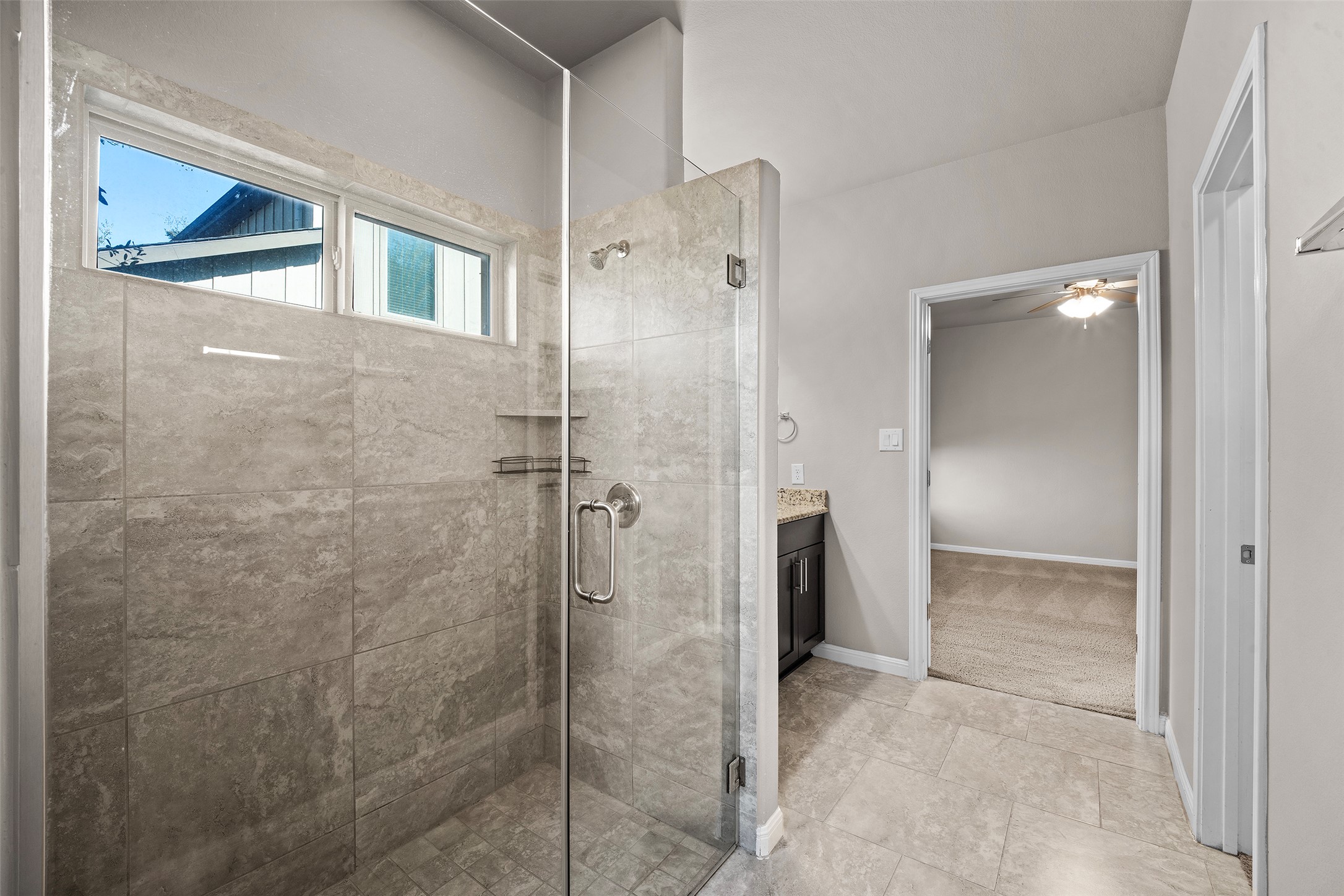 7233 Menchaca Road, Unit 2 Austin, TX 78745 - Photo 26 of 34 a bathroom with a shower and a glass door