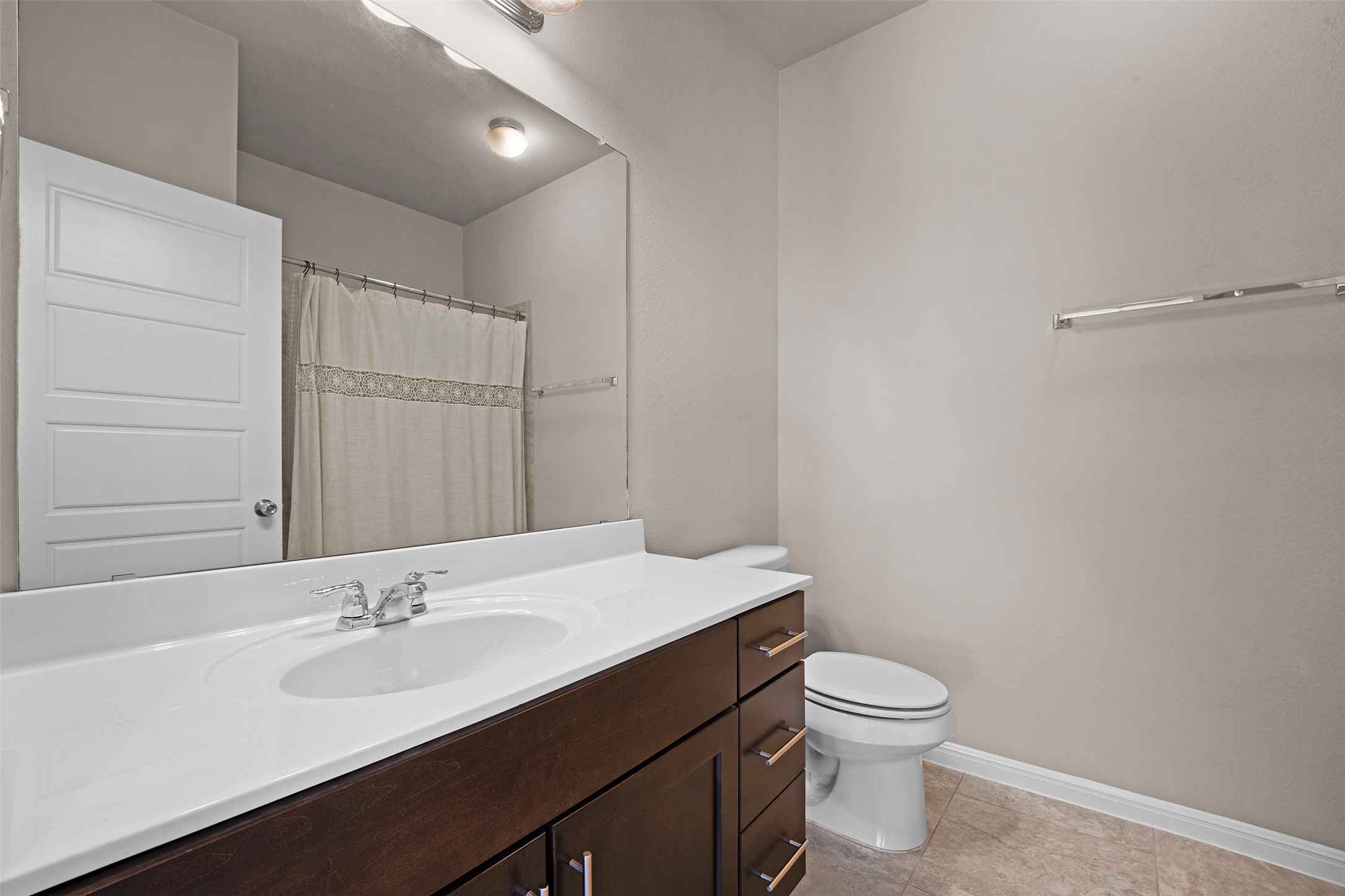 7233 Menchaca Road, Unit 2 Austin, TX 78745 - Photo 27 of 34 a bathroom with a sink toilet and vanity