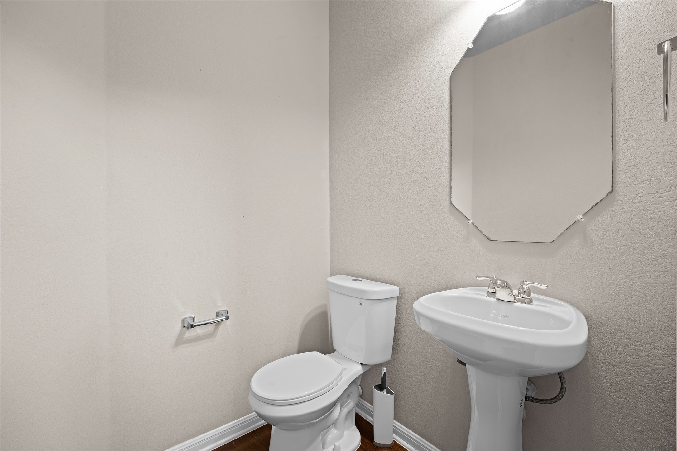 7233 Menchaca Road, Unit 2 Austin, TX 78745 - Photo 29 of 34 a bathroom with a sink toilet and a mirror