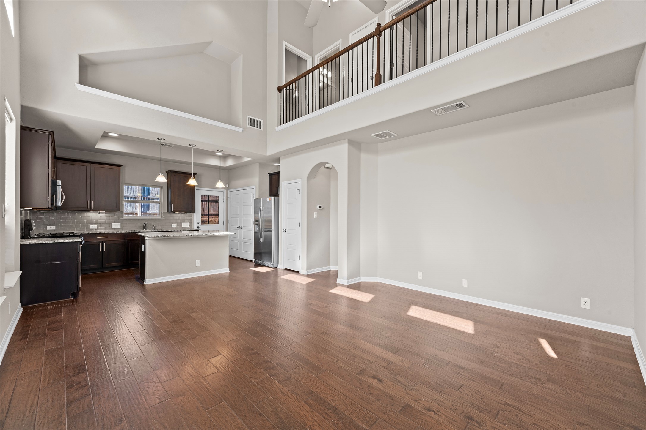 7233 Menchaca Road, Unit 2 Austin, TX 78745 - Photo 3 of 34 a view of kitchen with kitchen island white cabinets and stainless steel appliances