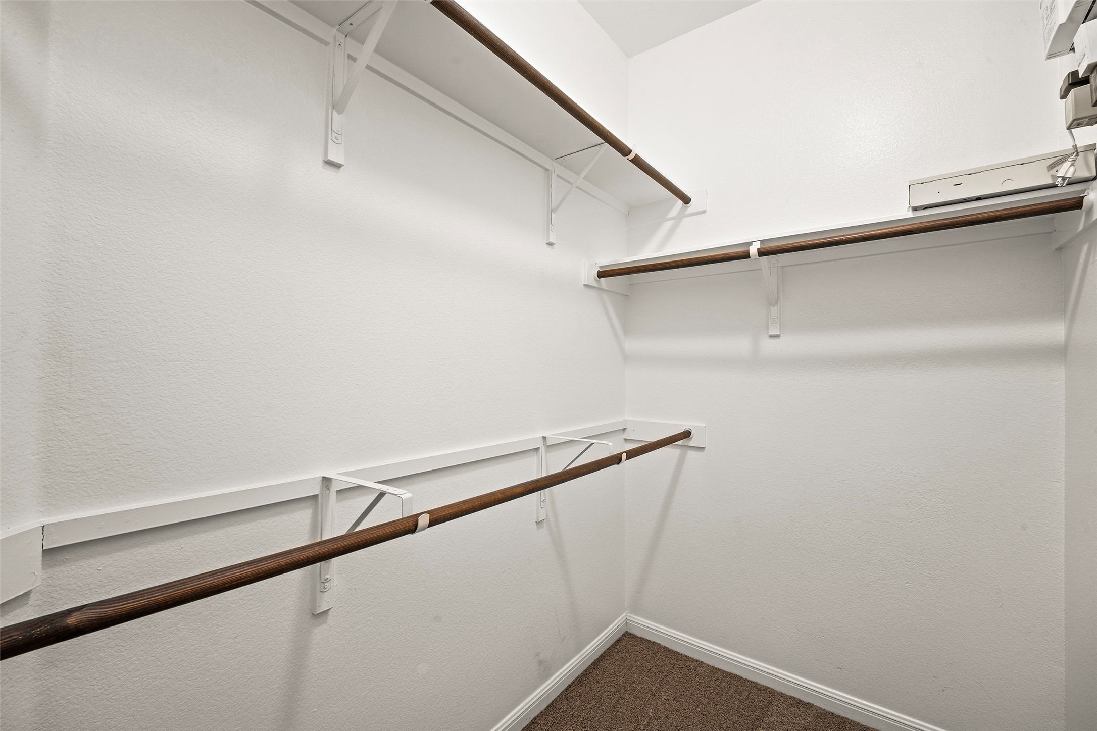 7233 Menchaca Road, Unit 2 Austin, TX 78745 - Photo 31 of 34 a view of a room with racks on the wall