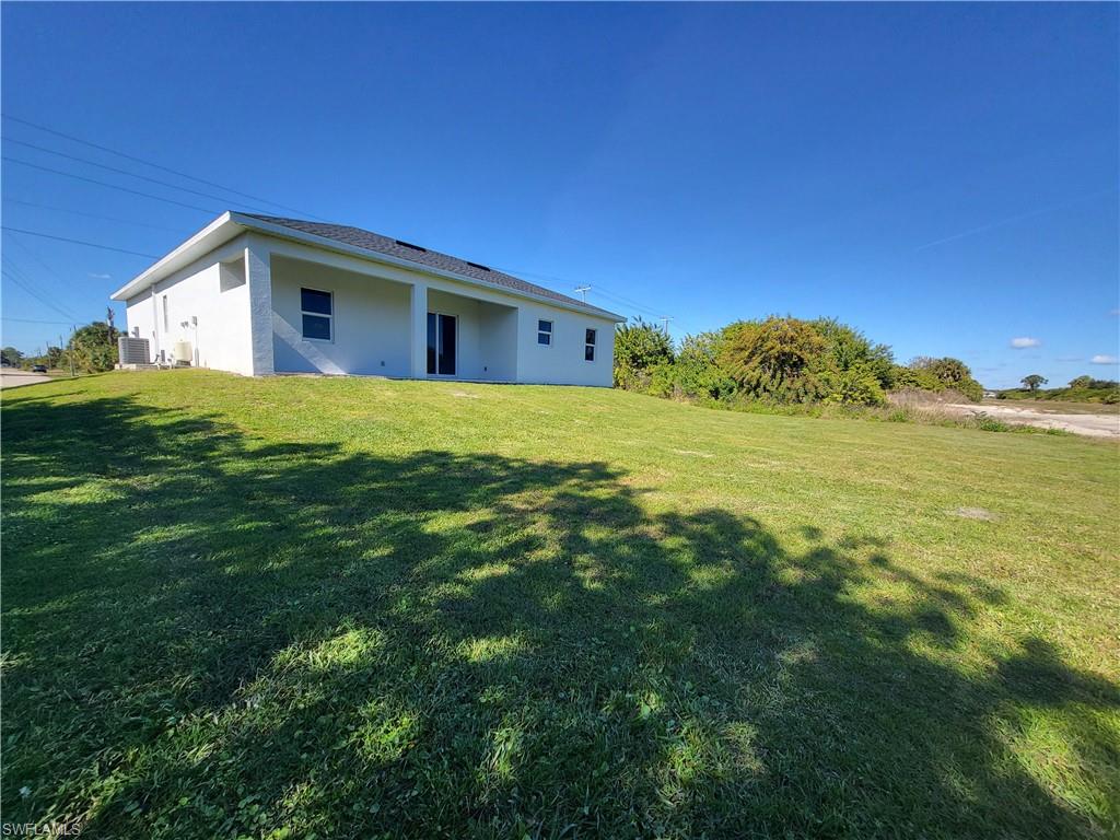 6120 Stratton Road Fort Myers, FL 33905 - Photo 2 of 27 a view of a house with a backyard
