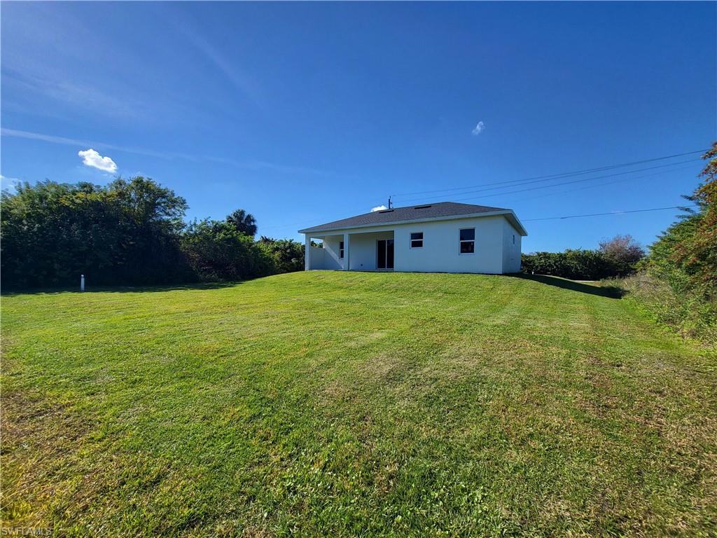6120 Stratton Road Fort Myers, FL 33905 - Photo 3 of 27 a view of a house with a yard
