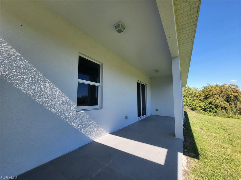 6120 Stratton Road Fort Myers, FL 33905 - Photo 4 of 27 a view of a hallway to the house