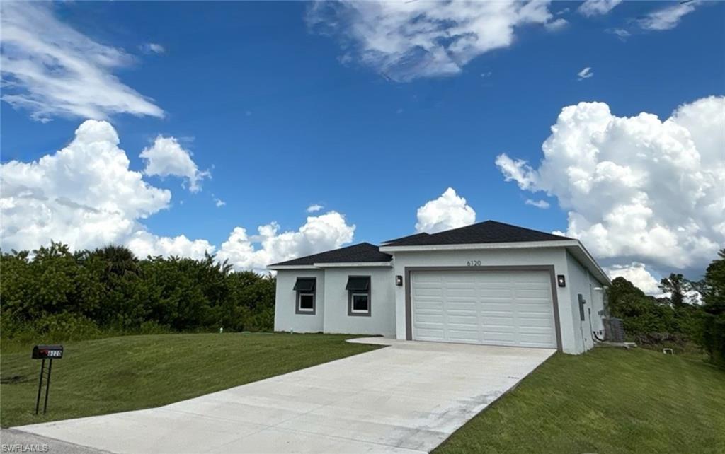 6120 Stratton Road Fort Myers, FL 33905 - Photo 5 of 27 a front view of a house with garden