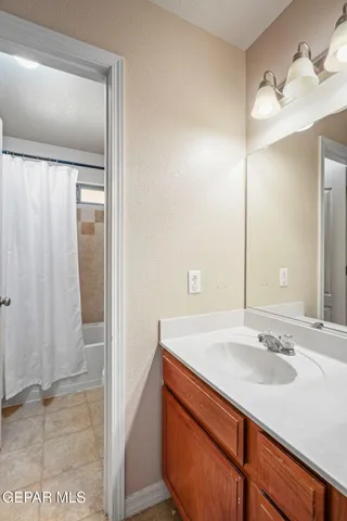 a bathroom with a toilet and a shower curtain