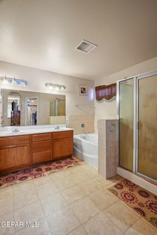 a bathroom with a bathtub and a shower