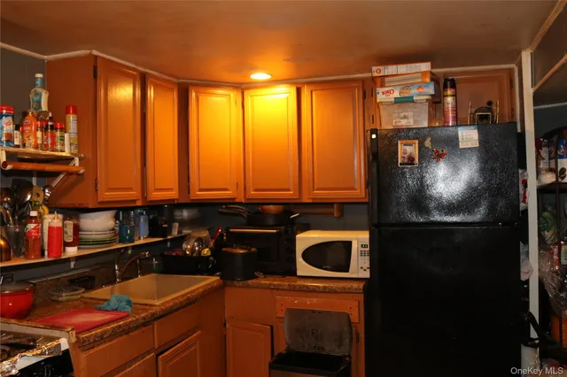 a room with chairs and washer dryer