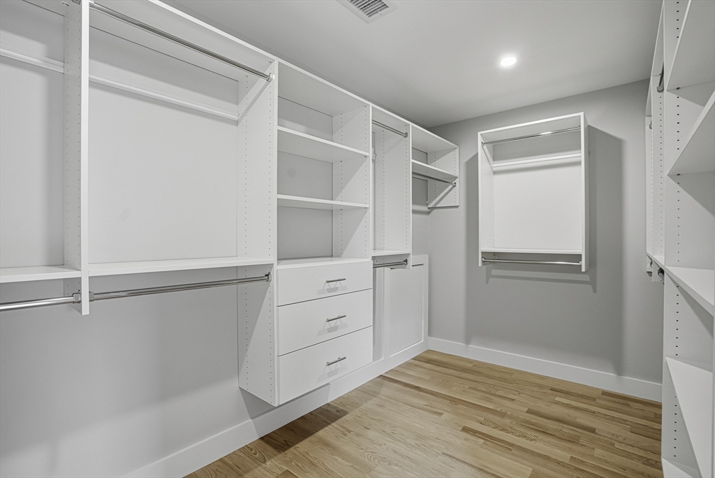 18 Avon Circle Needham, MA 02494 - Photo 14 of 18 a view of an empty walk in closet