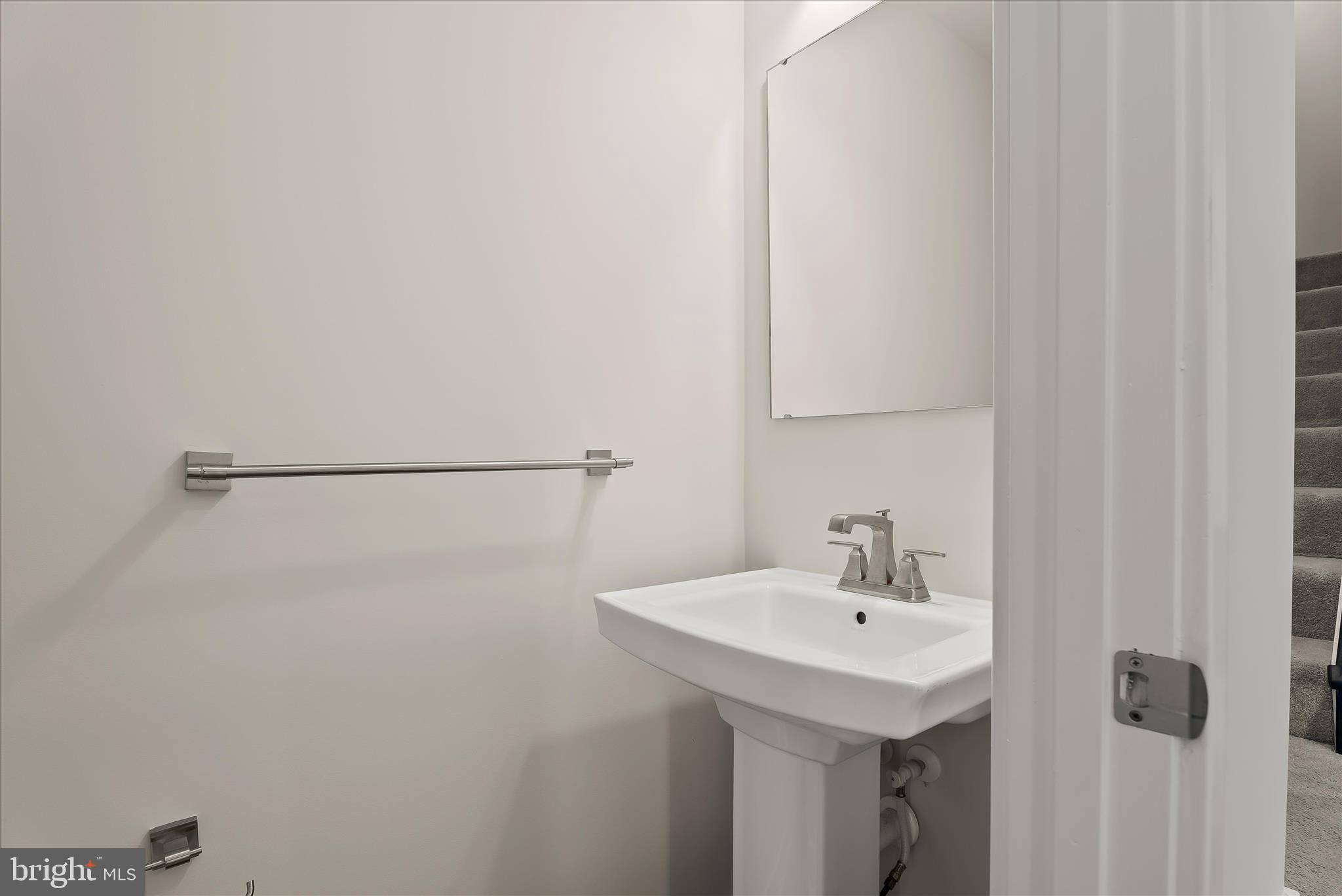 6072 Fallfish Court New Market, MD 21774 - Photo 28 of 78 a bathroom with a sink and mirror