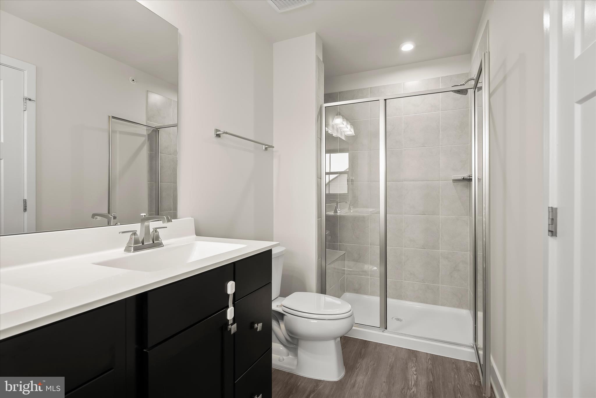 6072 Fallfish Court New Market, MD 21774 - Photo 34 of 78 a bathroom with a sink a toilet and shower