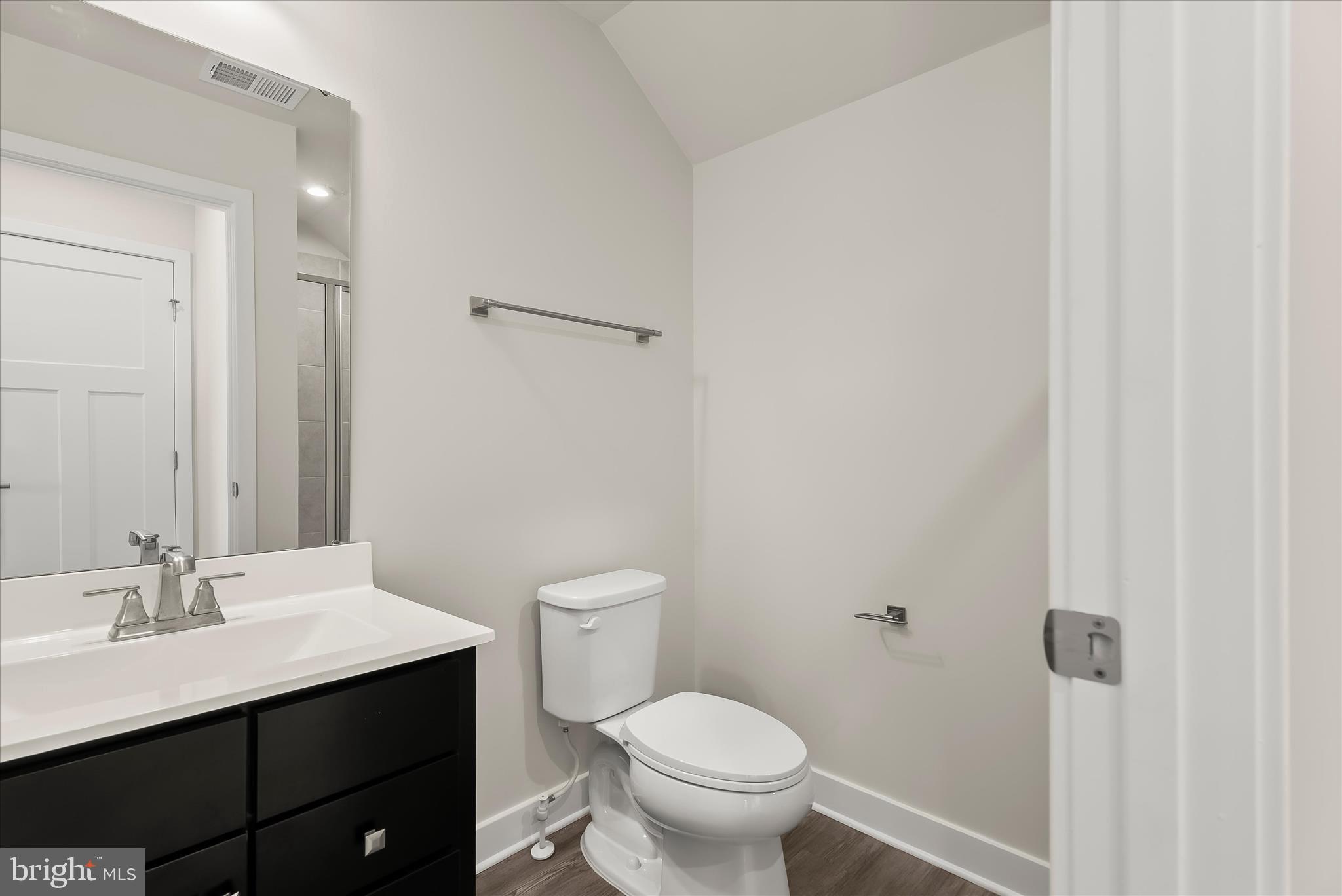 6072 Fallfish Court New Market, MD 21774 - Photo 47 of 78 a bathroom with a sink toilet and vanity