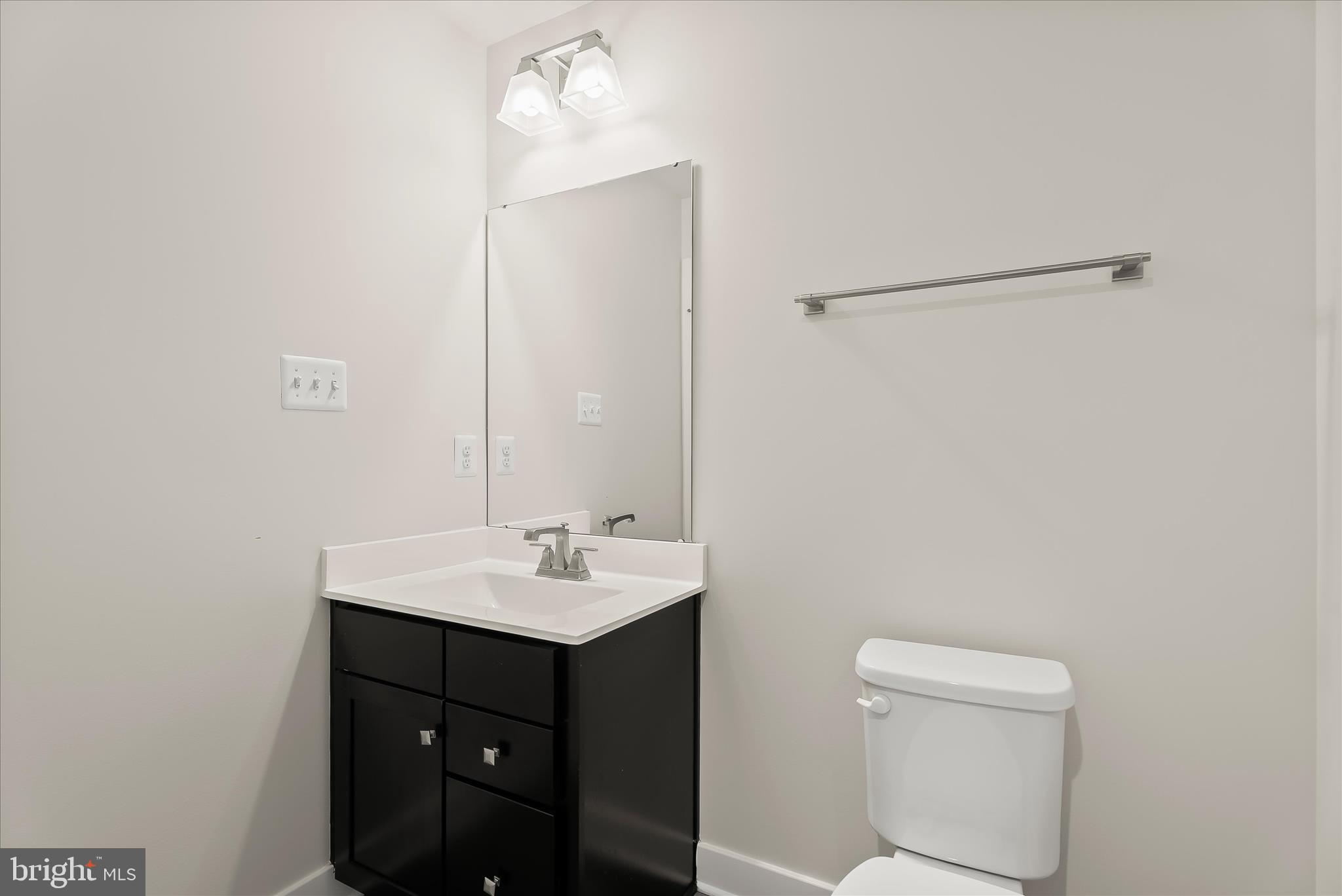 6072 Fallfish Court New Market, MD 21774 - Photo 49 of 78 a bathroom with a toilet a sink and mirror