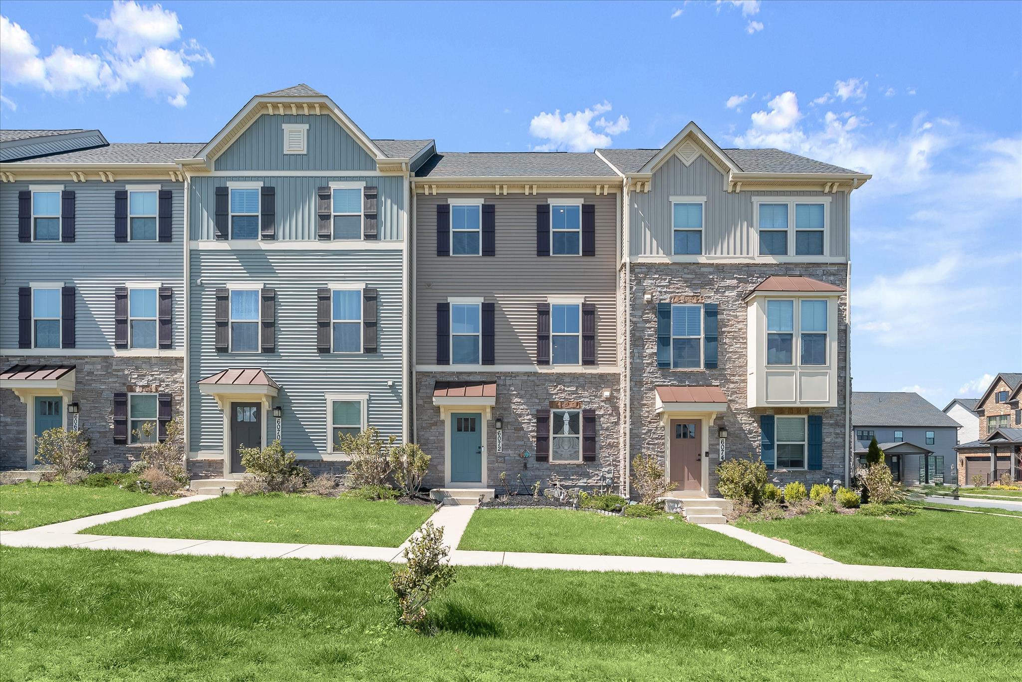 6072 Fallfish Court New Market, MD 21774 - Photo 53 of 78 a front view of a residential apartment building with a yard