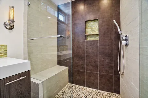 a bathroom with a shower and a sink