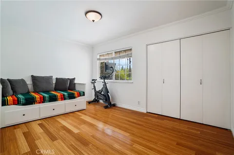 a view of a room with workspace and a window