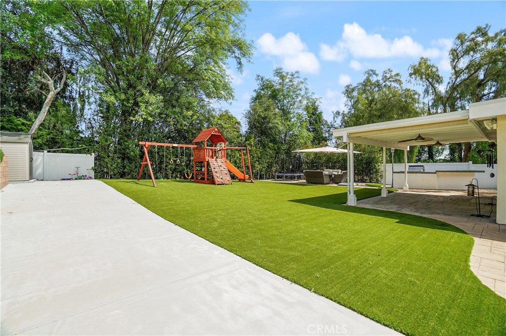 7044 Scarborough Peak Drive West Hills, CA 91307 - Photo 2 of 27 a view of a backyard with swimming pool