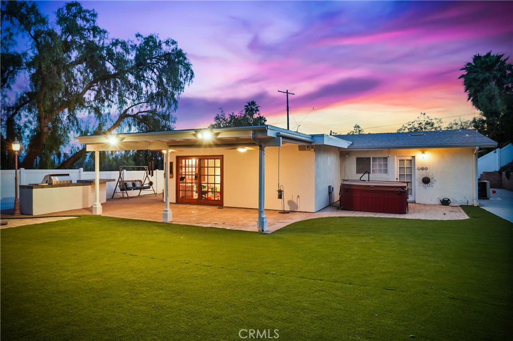 7044 Scarborough Peak Drive West Hills, CA 91307 - Photo 22 of 27 a view of a house with a yard patio and fire pit