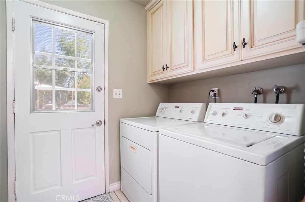 7044 Scarborough Peak Drive West Hills, CA 91307 - Photo 24 of 27 a utility room with dryer and washer