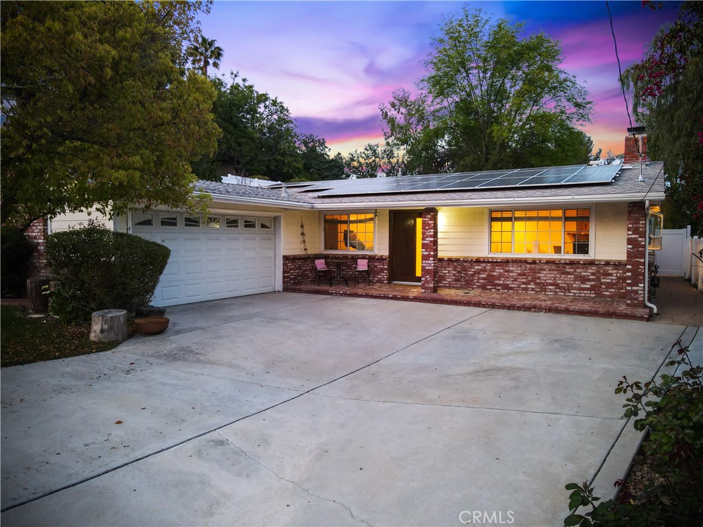 7044 Scarborough Peak Drive West Hills, CA 91307 - Photo 5 of 27 a view of a house with swimming pool and a yard