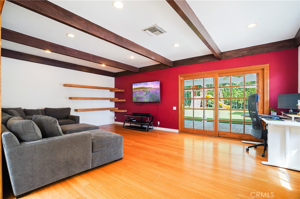 7044 Scarborough Peak Drive West Hills, CA 91307 - Photo 7 of 27 a living room with furniture and a large window