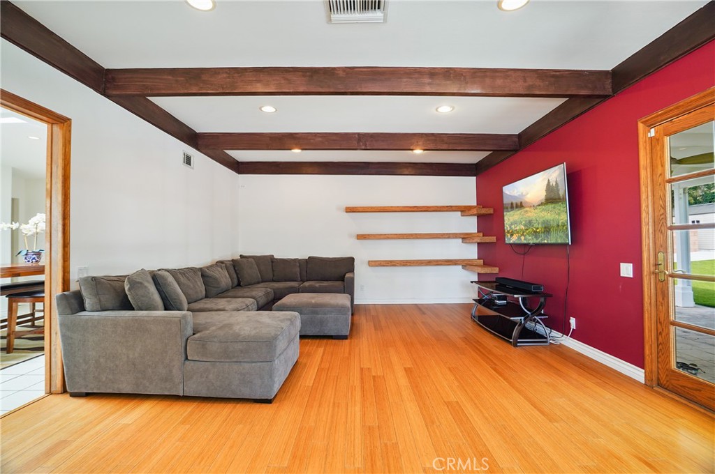7044 Scarborough Peak Drive West Hills, CA 91307 - Photo 8 of 27 a living room with furniture and a flat screen tv
