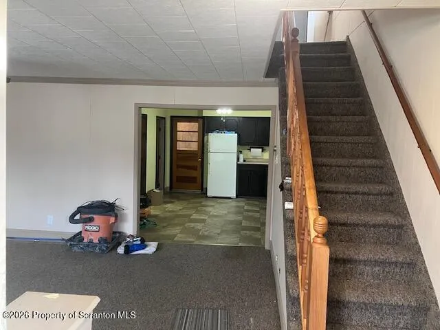 a view of hall way with furniture