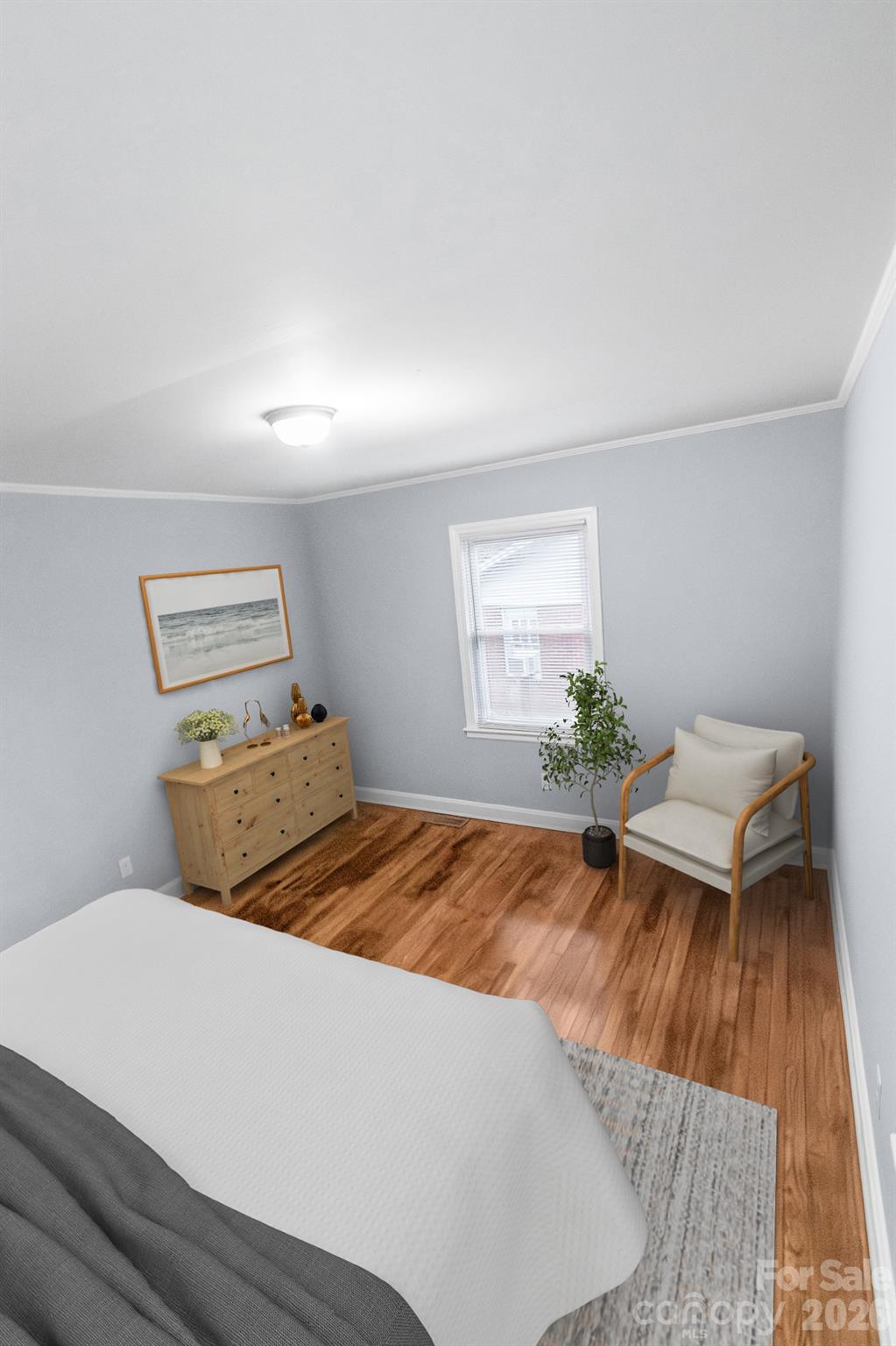 621 Reeves Court Charlotte, NC 28208 - Photo 7 of 11 a bedroom with a bed and a window