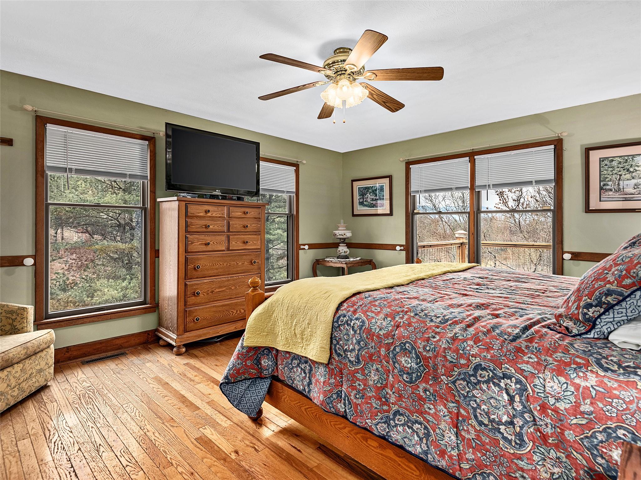2843 Hyder Mountain Road Clyde, NC 28721 - Photo 9 of 30 a bedroom with a large bed and a flat tv screen