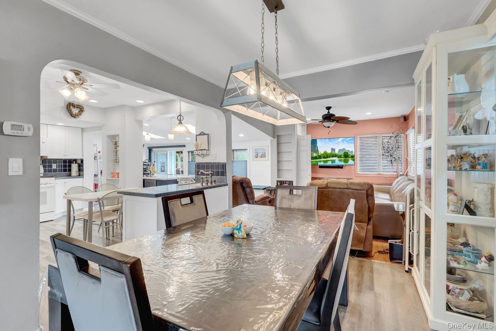 451 North Grove Street Valley Stream, NY 11580 - Photo 15 of 38 a large kitchen with a table and chairs