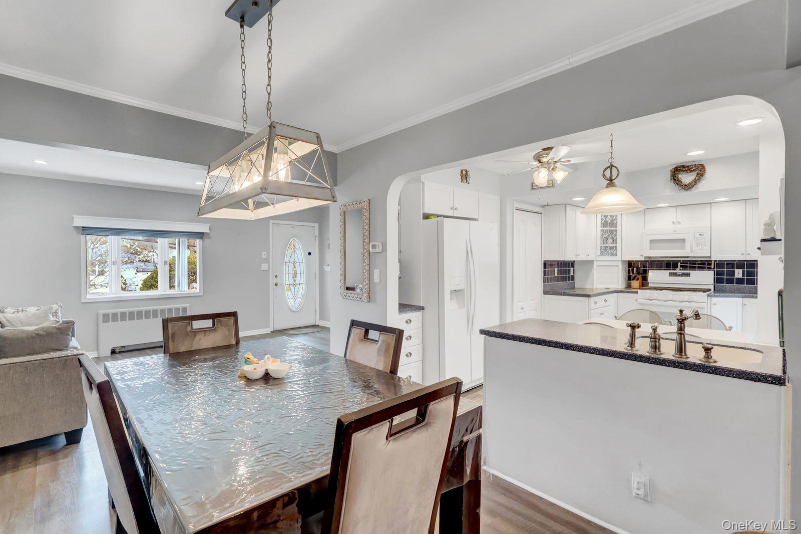 451 North Grove Street Valley Stream, NY 11580 - Photo 16 of 38 a view of a dining room and a chandelier