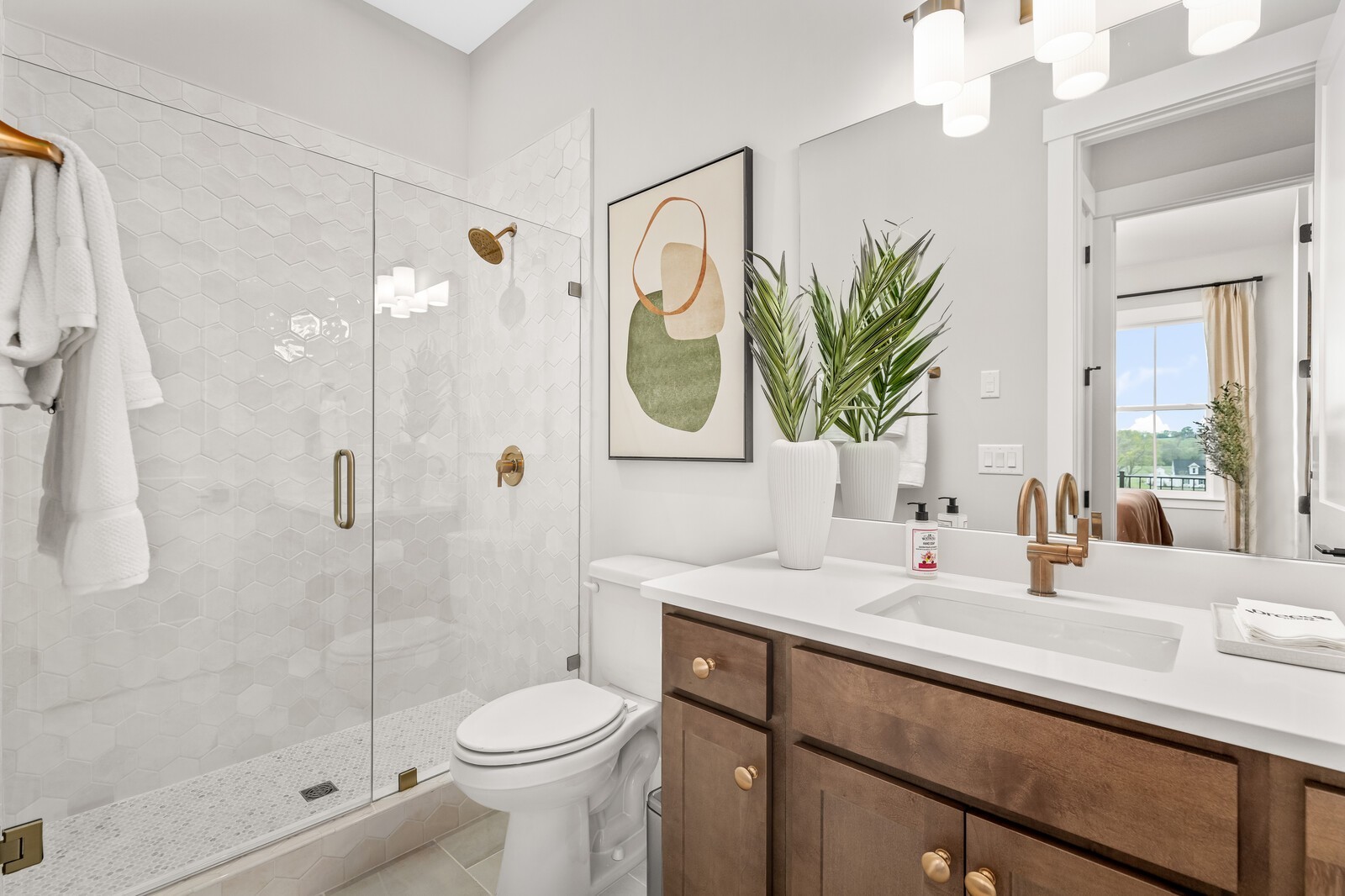 4740 Ash Hill Road Spring Hill, TN 37174 - Photo 31 of 82 a bathroom with a sink a toilet and shower