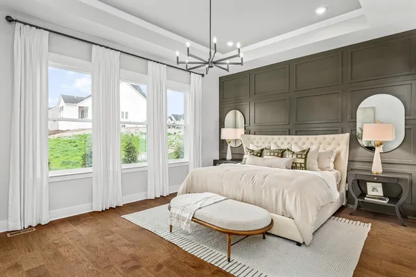 a bedroom with bed and a window