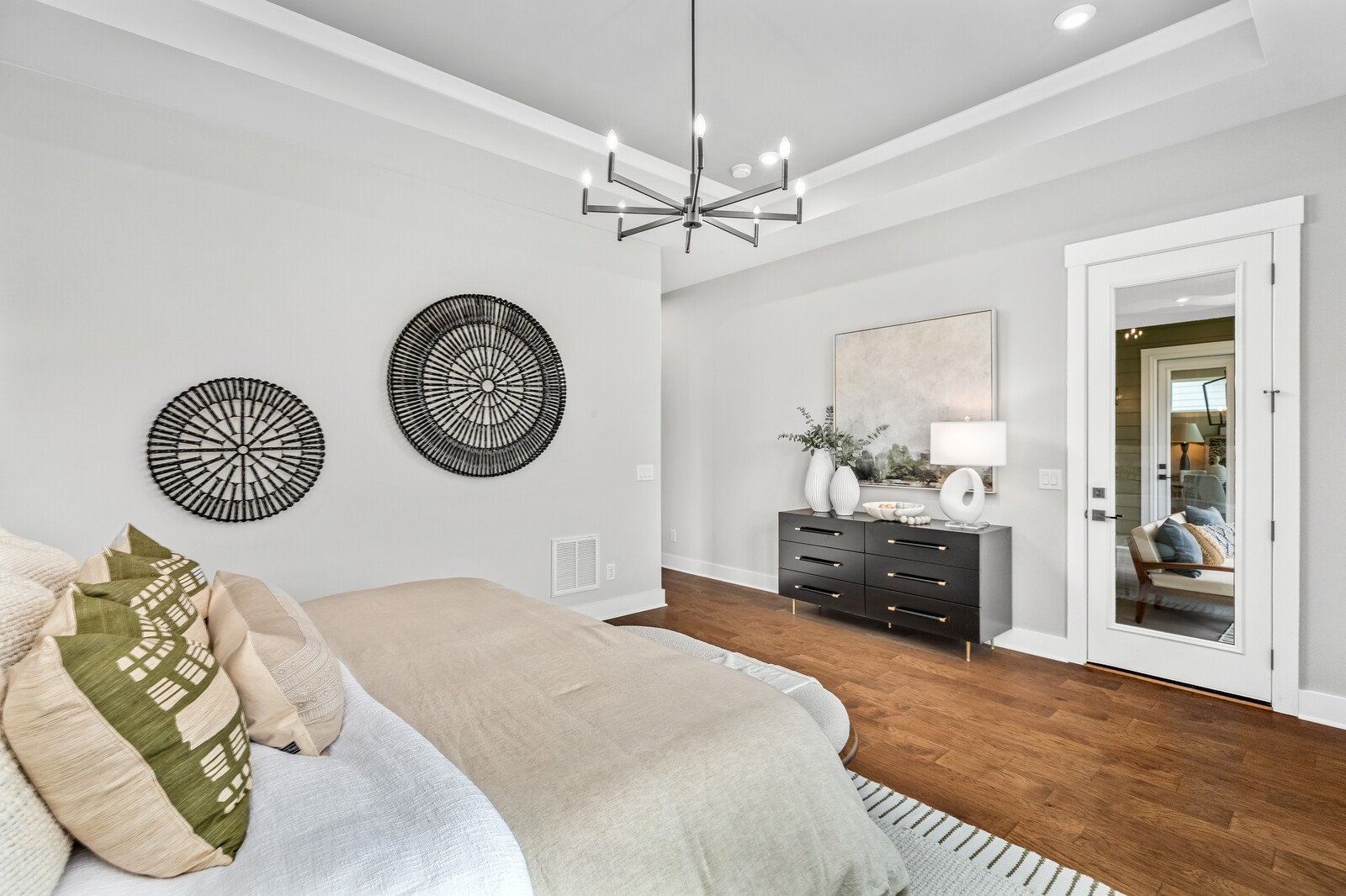 4740 Ash Hill Road Spring Hill, TN 37174 - Photo 33 of 82 a bedroom with a bed and a chandelier