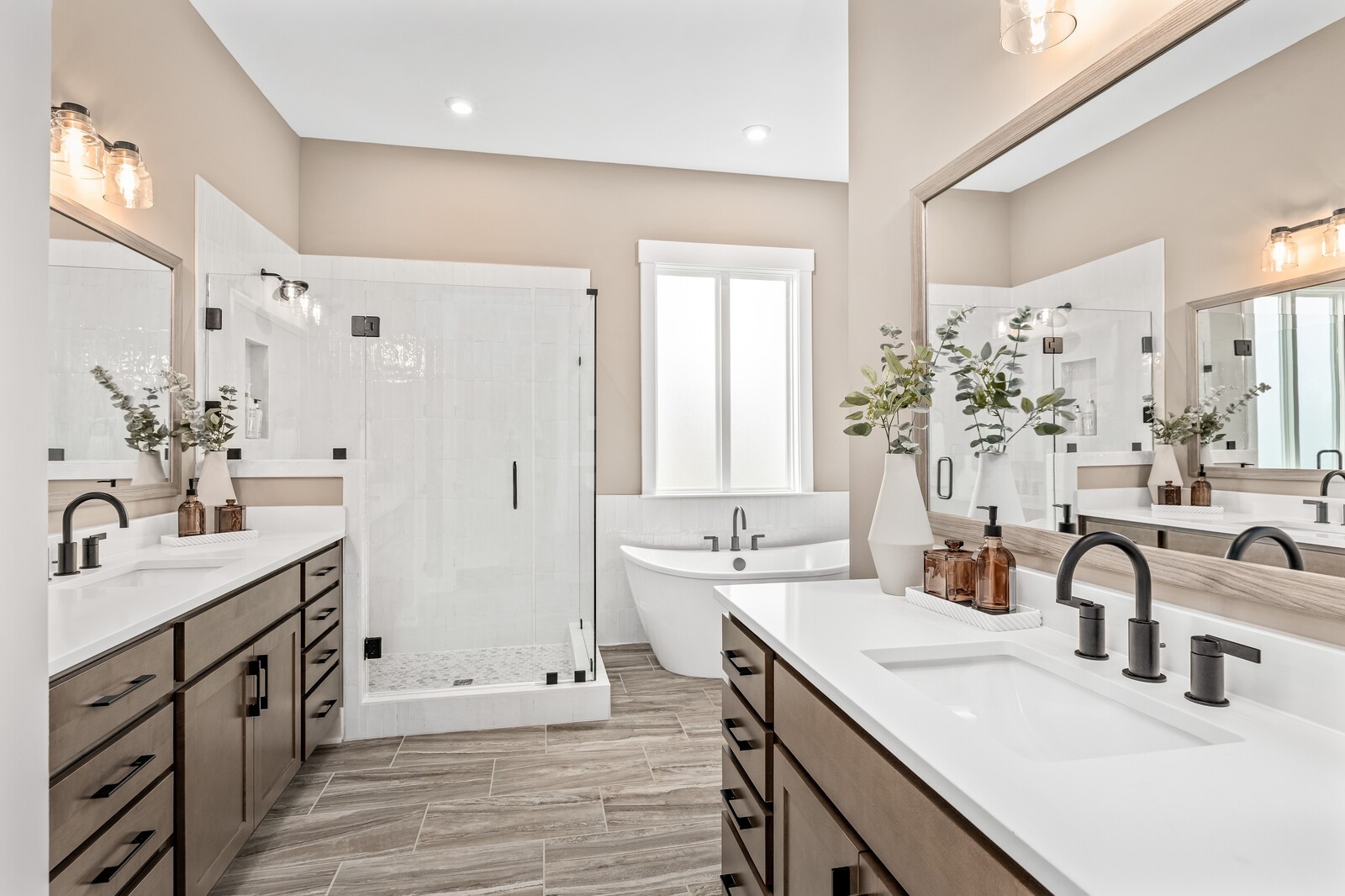 4740 Ash Hill Road Spring Hill, TN 37174 - Photo 34 of 82 a bathroom with double vanity sinks a large mirror and a shower