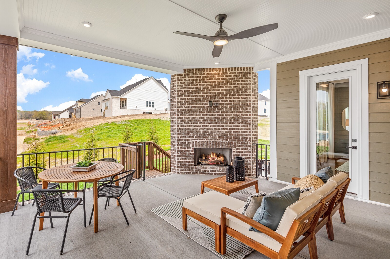 4740 Ash Hill Road Spring Hill, TN 37174 - Photo 52 of 82 a living room with furniture a large window and a chandelier