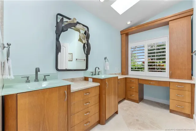 a bathroom with a granite countertop sink mirror and a