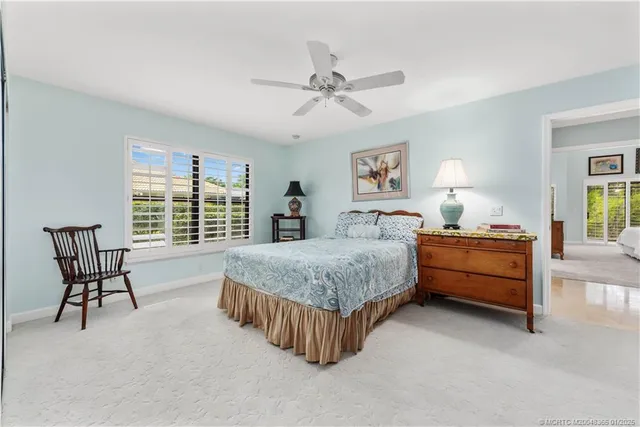 a spacious bedroom with a bed and a table